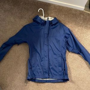 A small blue Helly Hansen rain jacket